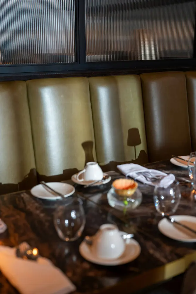 table setting with teacups and small tart