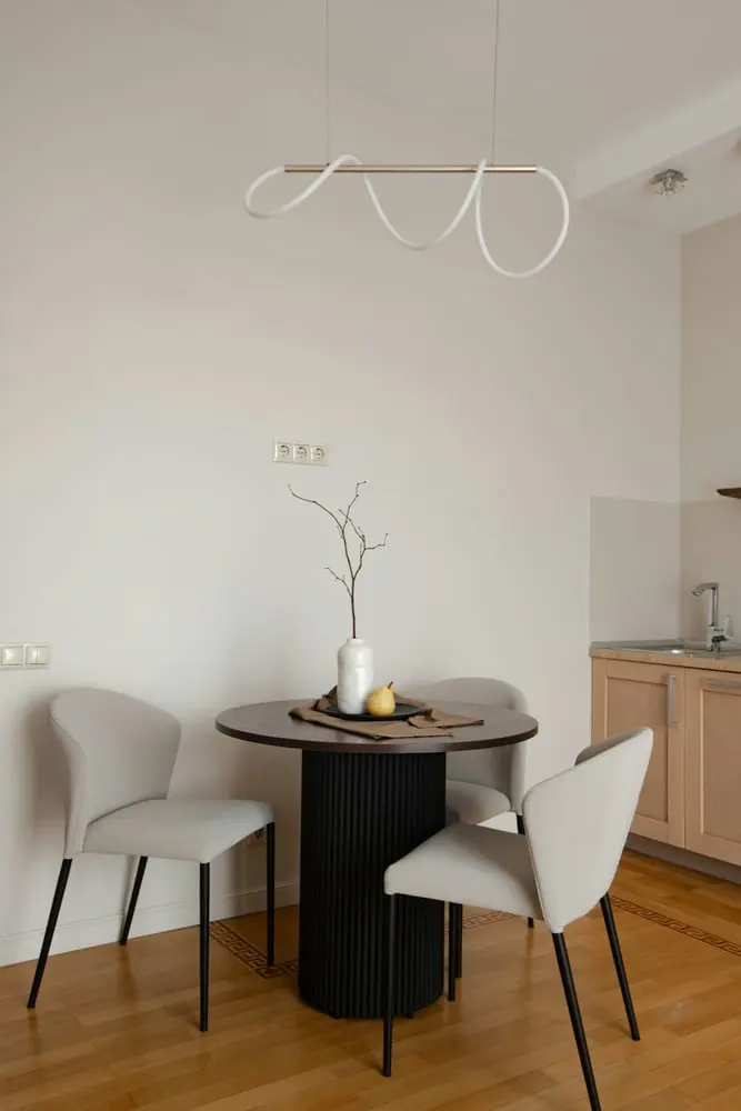 modern dining area with a round table and chairs