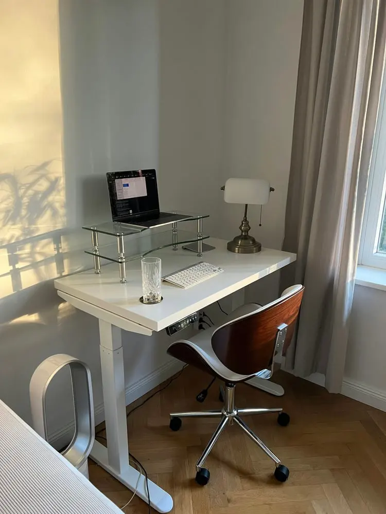 a desk with a computer on it