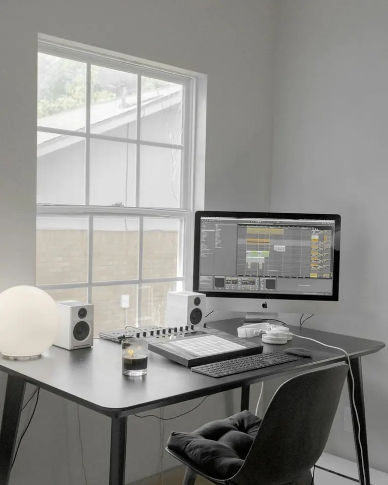 black flat screen computer monitor on white wooden desk