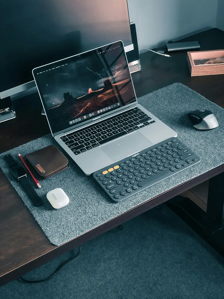 macbook pro on brown wooden table