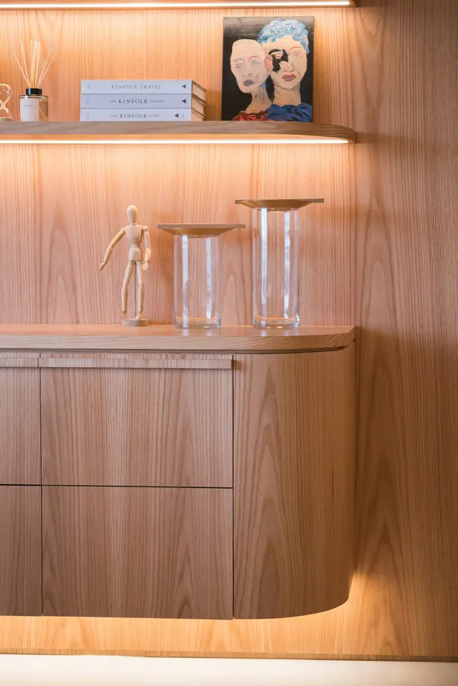 wooden cabinet with decorative items on shelf