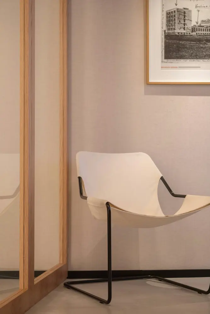 modern chair with black metal frame and canvas seat