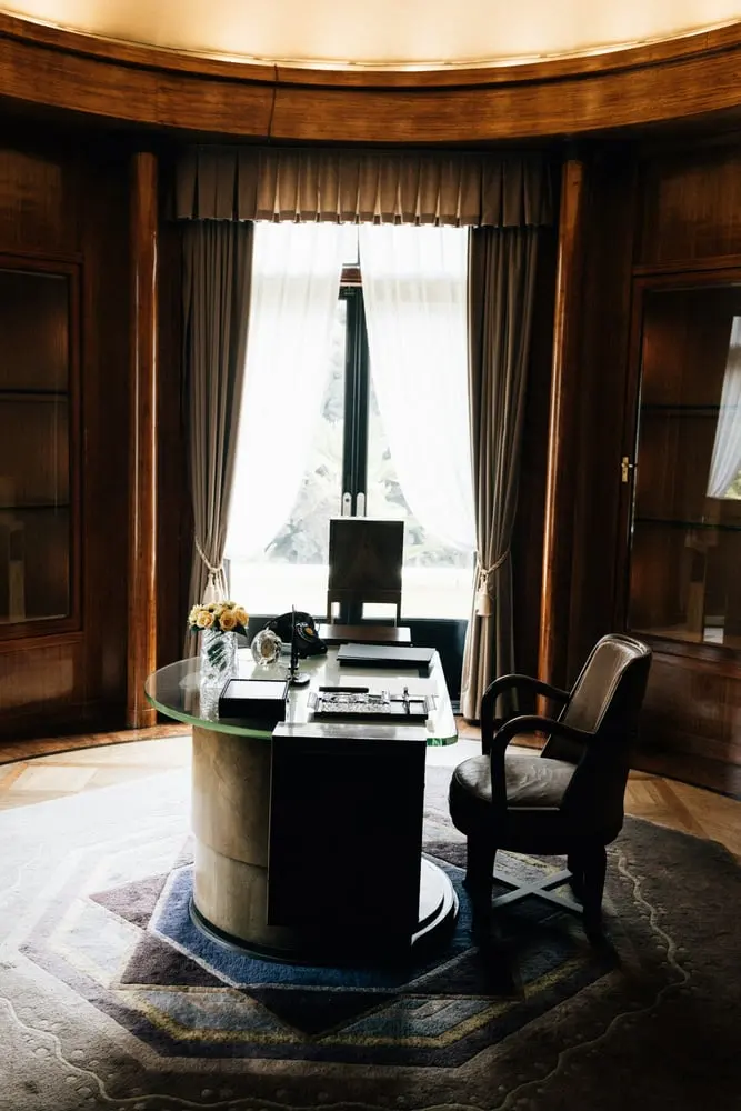 elegant office with desk chair and large window