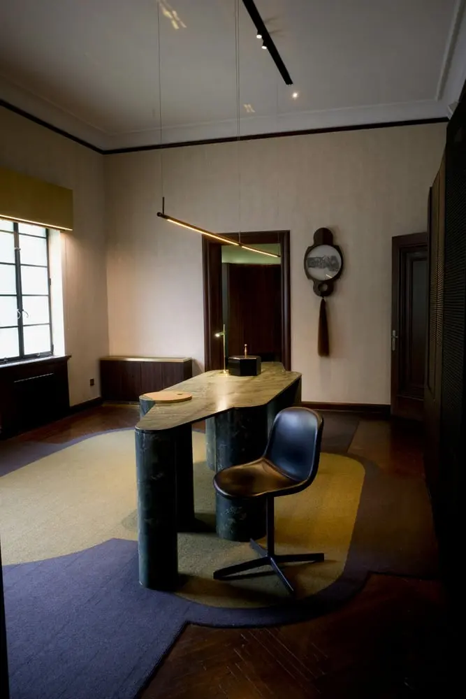 stylish office interior featuring a contemporary desk and abstract rug