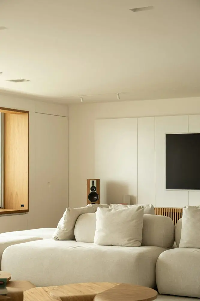 modern living room with sectional sofa and speaker