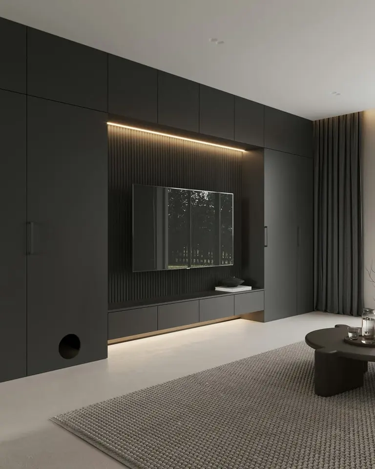 a living room with a couch coffee table and television