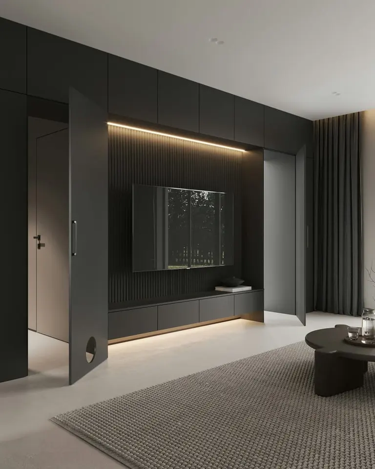 a living room with a couch coffee table and television