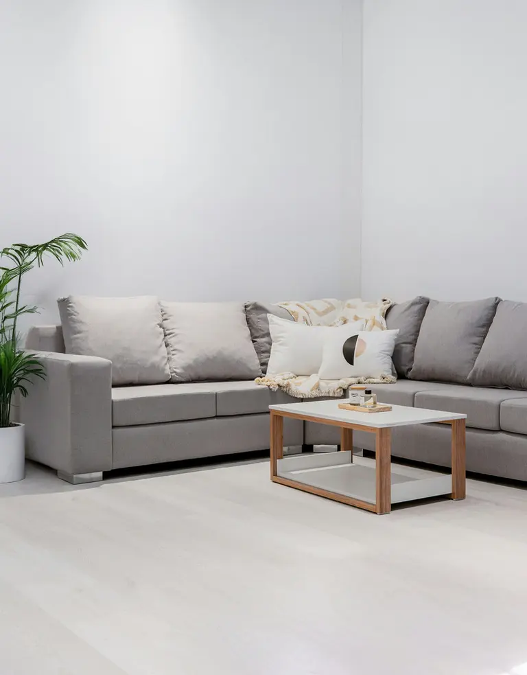 a modern living room with a gray sectional sofa