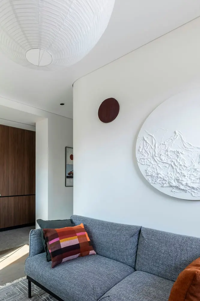 contemporary living room interior with sofa art and paper lantern