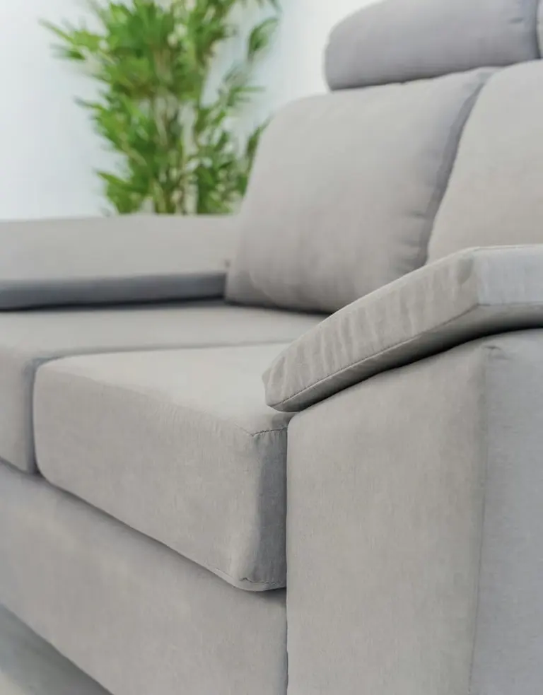 a modern grey sofa with plush cushions