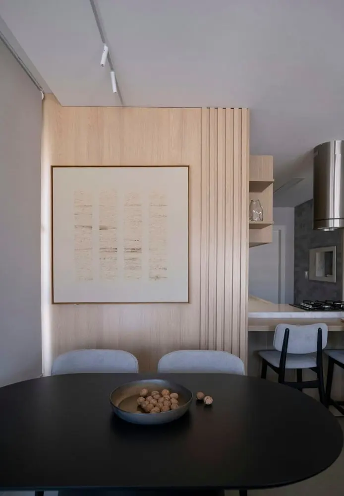 modern dining area with artwork and pendant lights